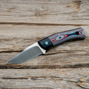 Buccaner - Fordite w/ Black Canvas Micarta